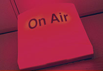 Graphic Image  of Neon Sign Display that says " On Air"